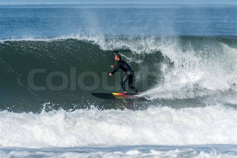 Stand up paddle surfer on the atlantic ocean, stock photo
