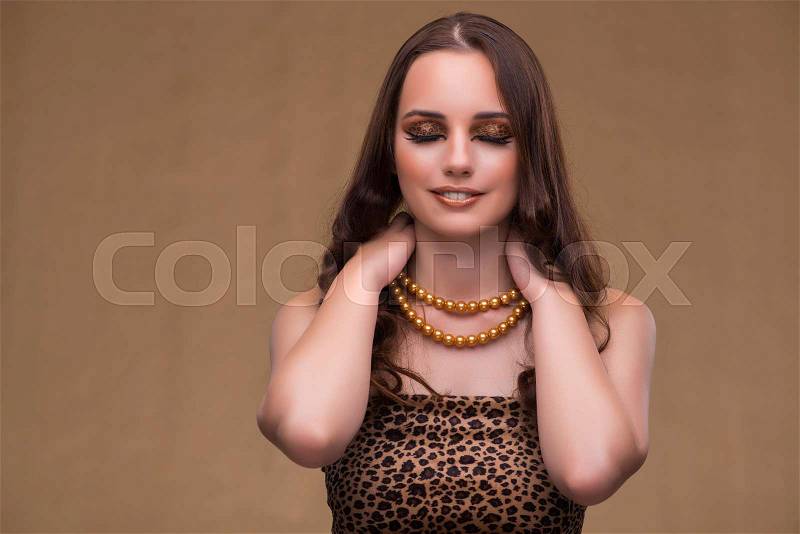 Young beautiful woman with pearl necklace, stock photo