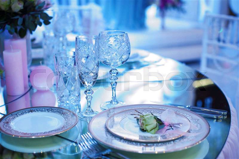 Festive decorated table in the restaurant for Christmas in blue and white tone, stock photo
