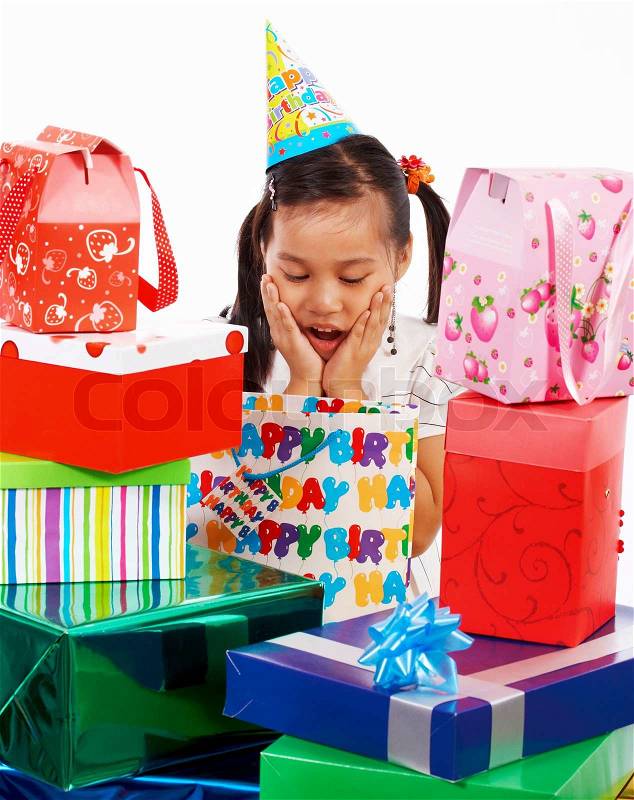 Girl Excited On Her Birthday As She Receives Many Gifts, stock photo