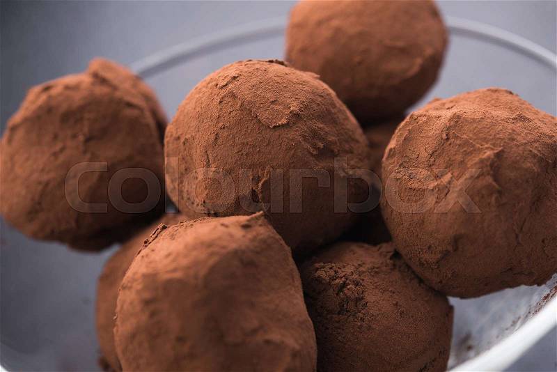 Chocolate cocoa truffles is glass , stock photo
