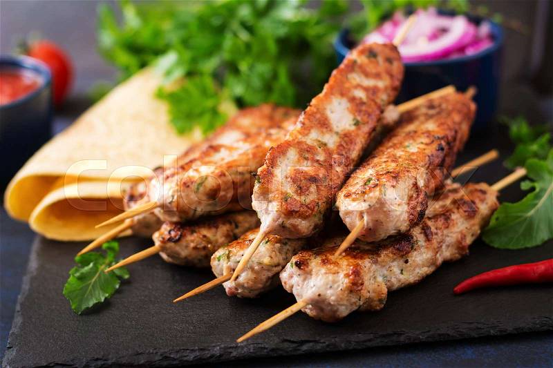 Minced Lula kebab grilled turkey (chicken) with vegetables, stock photo