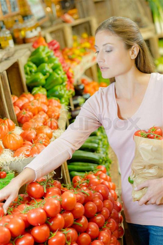 Shopping for some tomatoes, stock photo