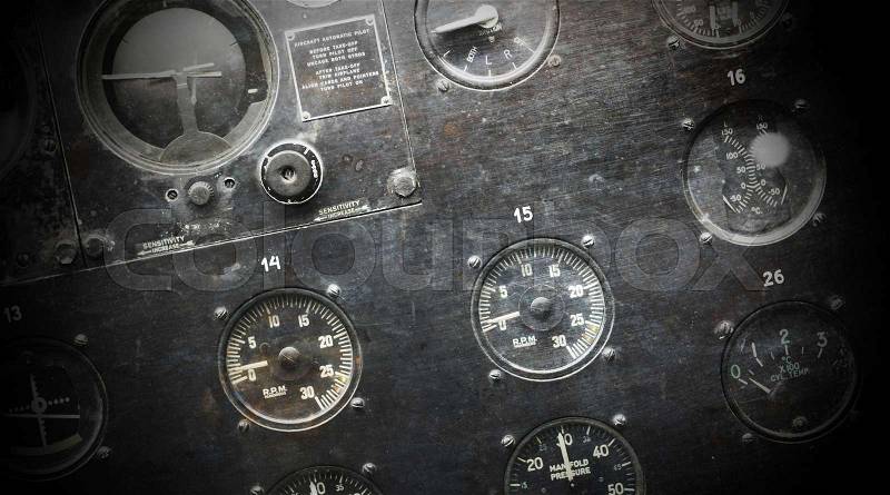 Different meters and displays in the console of an old plane, stock photo