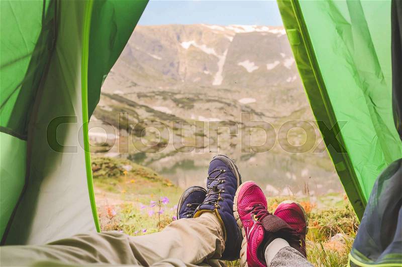 View from tourist tent inside on the mountain landscape. couple at the mountains, stock photo