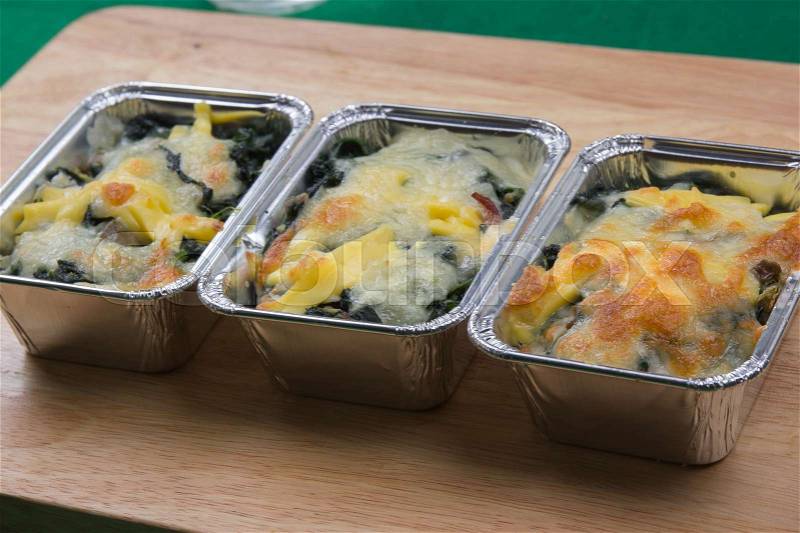 Baked cheese spinach in box / cooking Baked spinach concept, stock photo