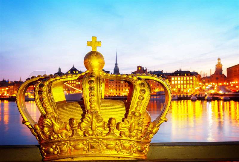 Royal crown and Stockholm cityscape at night, Sweden, toned, stock photo