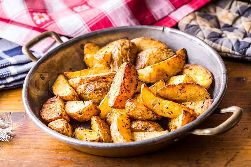 Potato. Roasted potatoes. American potatoes with salt pepper and cumin. Roasted potato wedges delicious crispy, stock photo