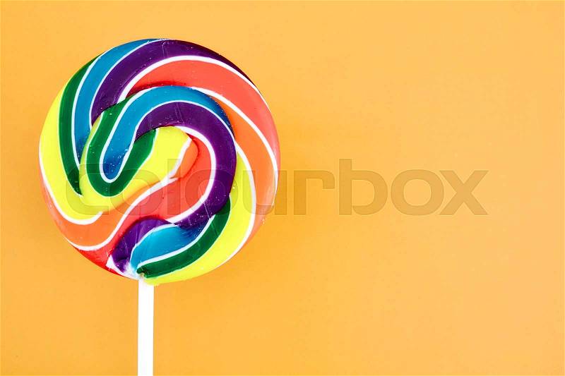 A studio photo of a candy swirl lollypop, stock photo