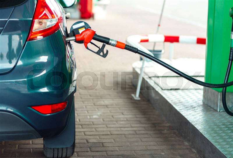 Car refueling on a petrol station close up, stock photo