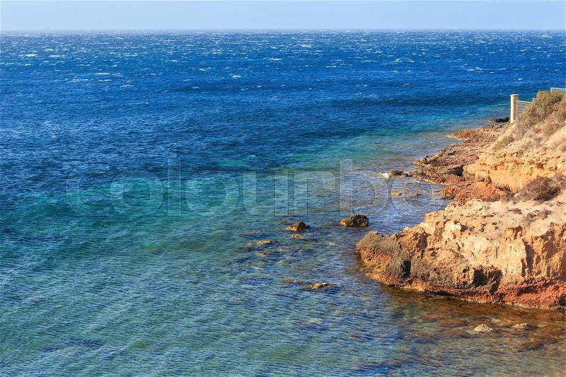 Atlantic ocean rocky coast scenery (stormy weather). Costa Blanca, Spain, stock photo