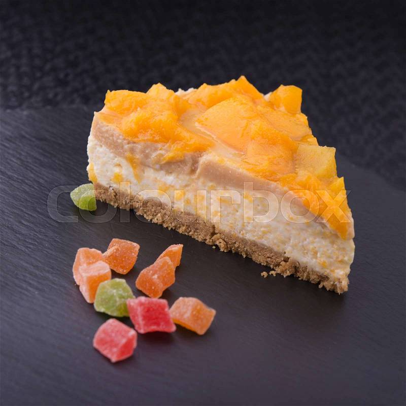 Tasty piece of cake on stone slate. restaurant dessert on the pitch, stock photo