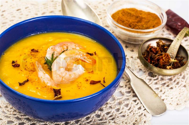 Pumpkin Soup with Prawns and Curry Studio Photo, stock photo