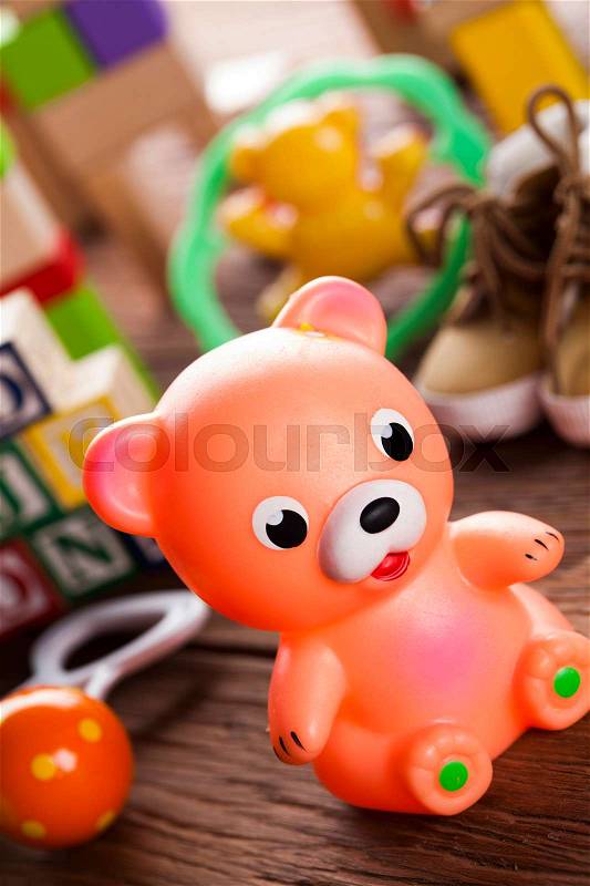 Pile of toys, collection on wooden background, stock photo