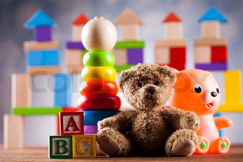 Cute teddy bear on wooden background, stock photo