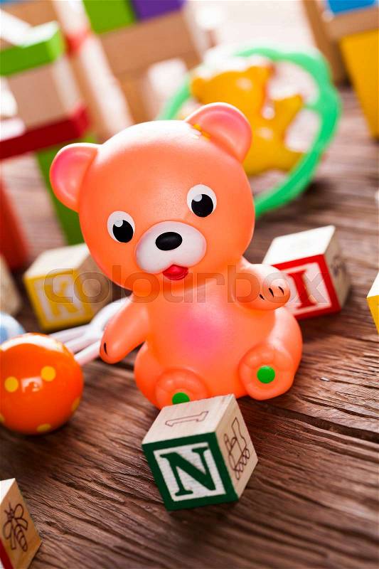 Baby World toy collection on on wooden background, stock photo