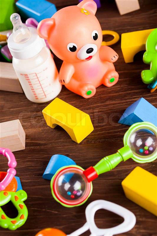 Children's of toy accessories on wooden background, stock photo