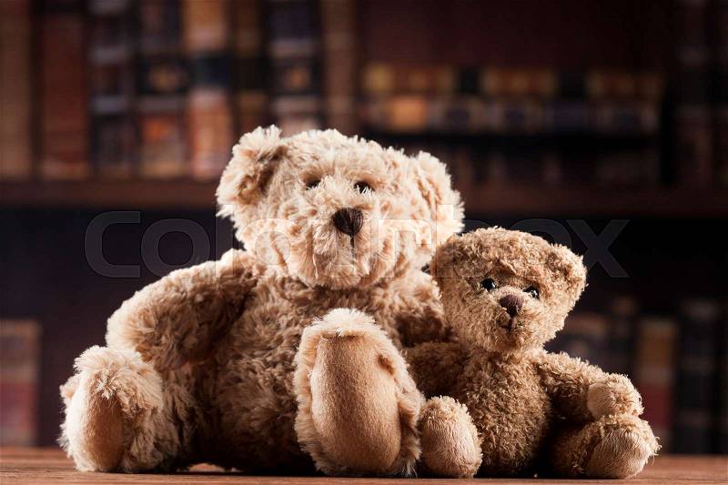 Group of cute teddy bears on vintage wooden background, stock photo