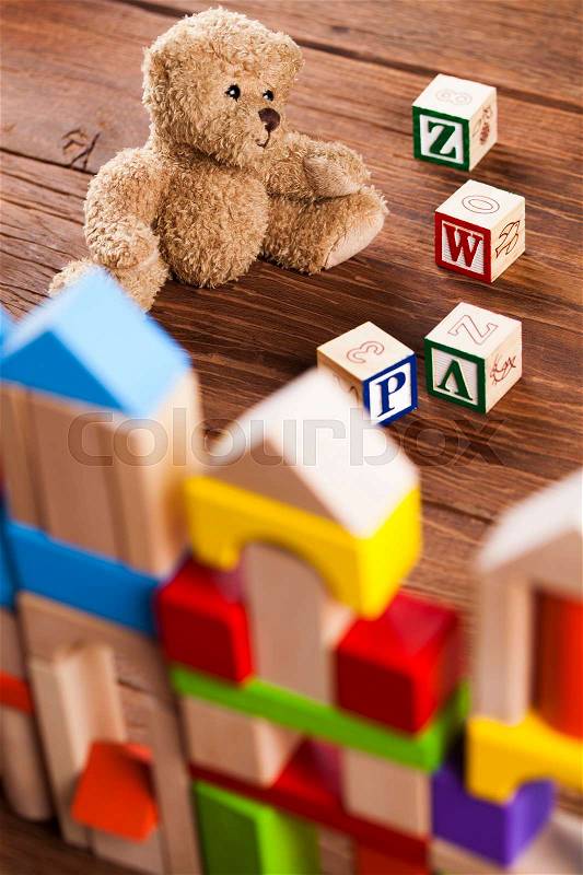 Children\'s of toy accessories on wooden background, stock photo
