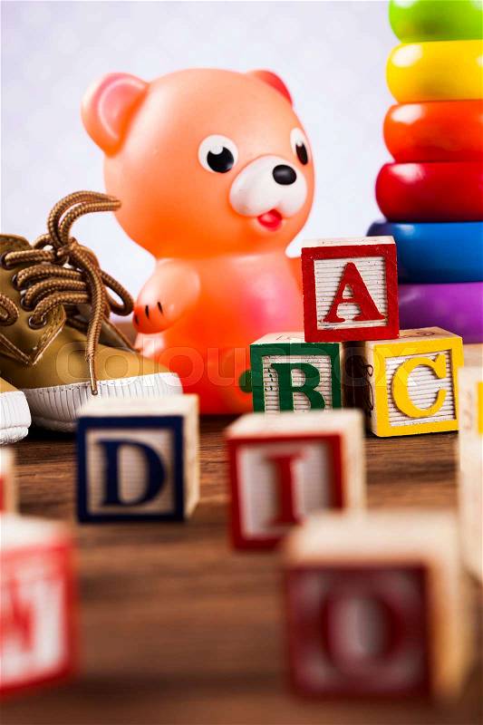 Children's of toy accessories on wooden background, stock photo