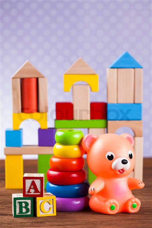 Baby World toy collection on on wooden background, stock photo