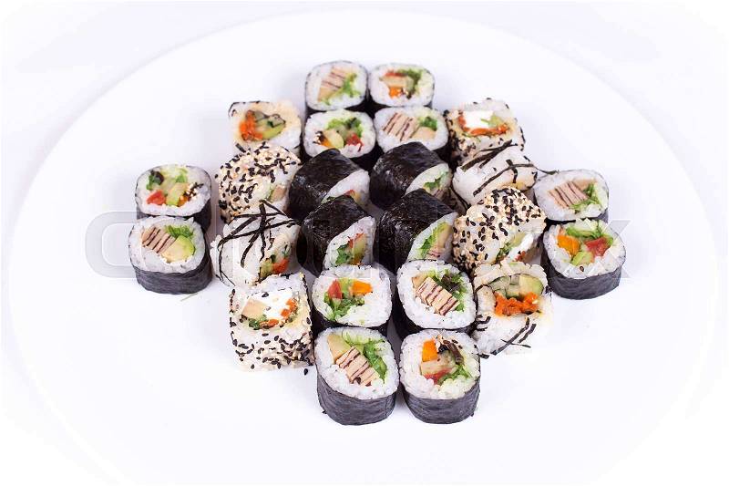 Japanese food restaurant, sushi maki gunkan roll plate or platter set. California Sushi rolls with salmon. Sushi isolated at white background. Top view, flat lay, stock photo