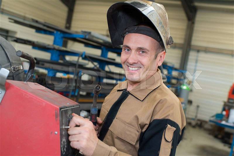 Welder happy and ready to work, stock photo