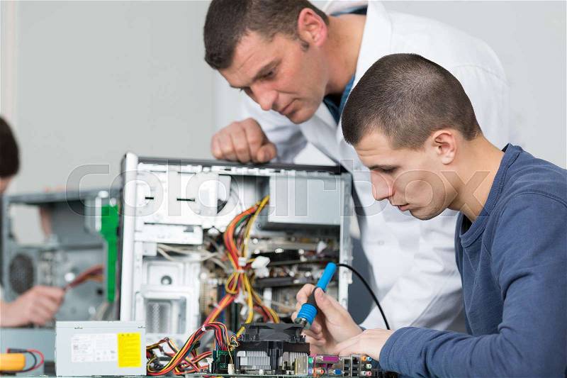 Student and teacher in electrical engineering course, stock photo