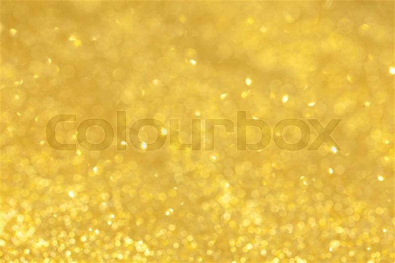 Shining gold glitter detailed texture for background (Selective focus), stock photo