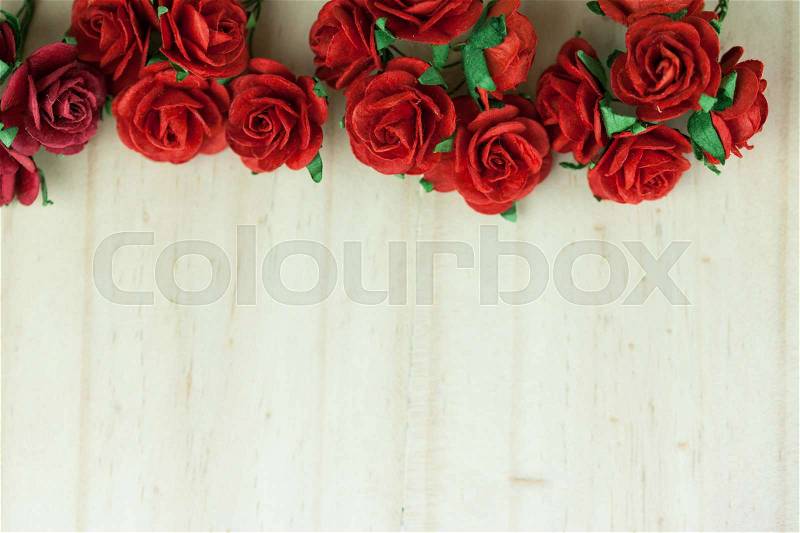 Bunch of red roses in light wood background - Can be used for festive events and celebration, stock photo