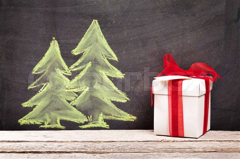 Christmas gift box and hand drawn xmas fir tree, stock photo