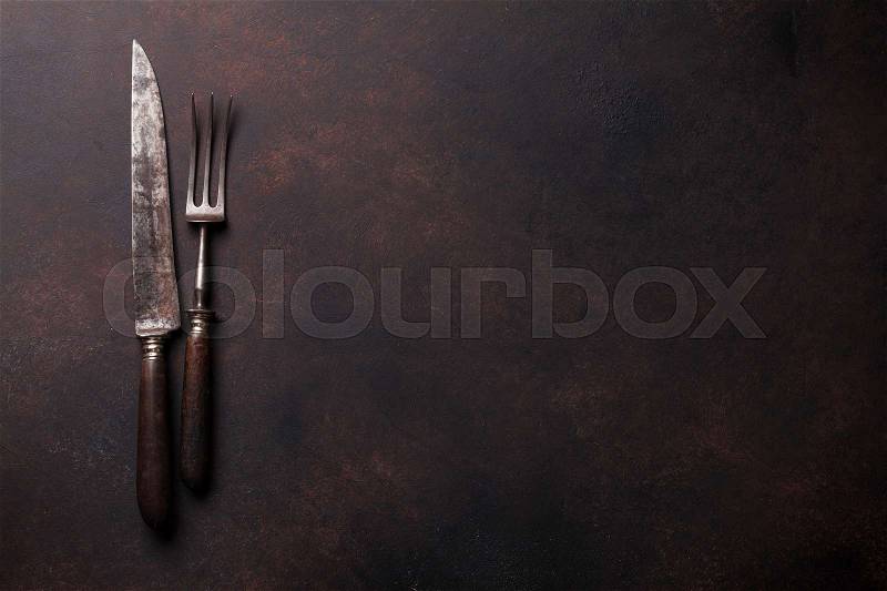 Old vintage kitchen utensils. Fork and knife. Top view with copy space, stock photo
