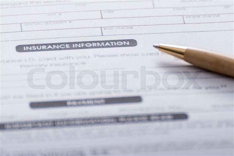 Close-up of Health Insurance Claim Application Form with pen, stock photo