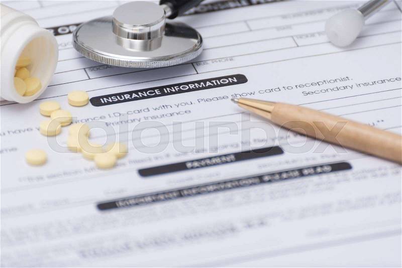 Close-up of patient information concept,Stetoscope and medicine,pen on patient form on the desk, stock photo