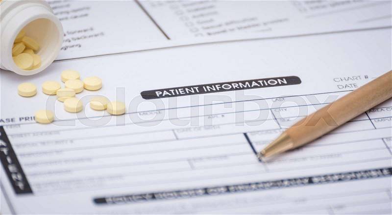 Close-up of patient information concept,medicine and pen on patient form on the desk, stock photo