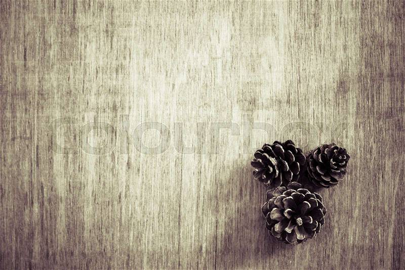 View from above Christmas background with pine corns. Vintage filter color, stock photo