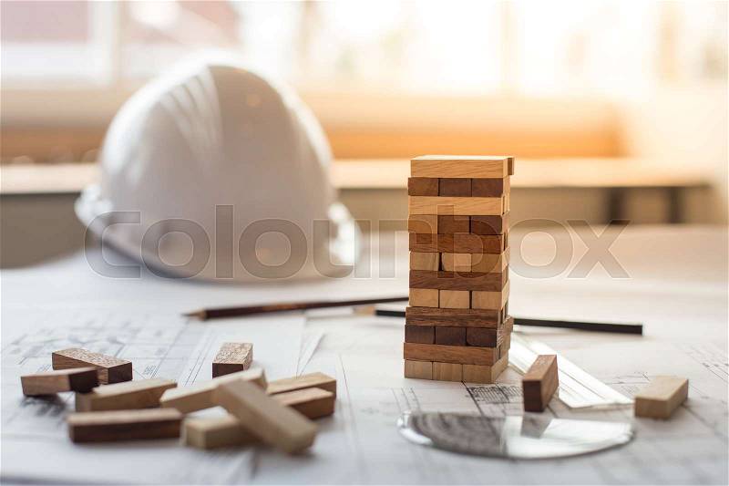 Blueprint wooden block tower, Planning, risk and strategy in business or architectural project, stock photo
