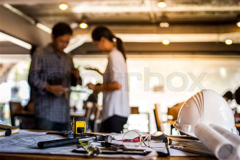 Architectural Office desk background construction project ideas concept, With drawing equipment with mining light, stock photo