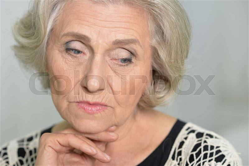 Portrait of a beautiful senior woman thinking, stock photo