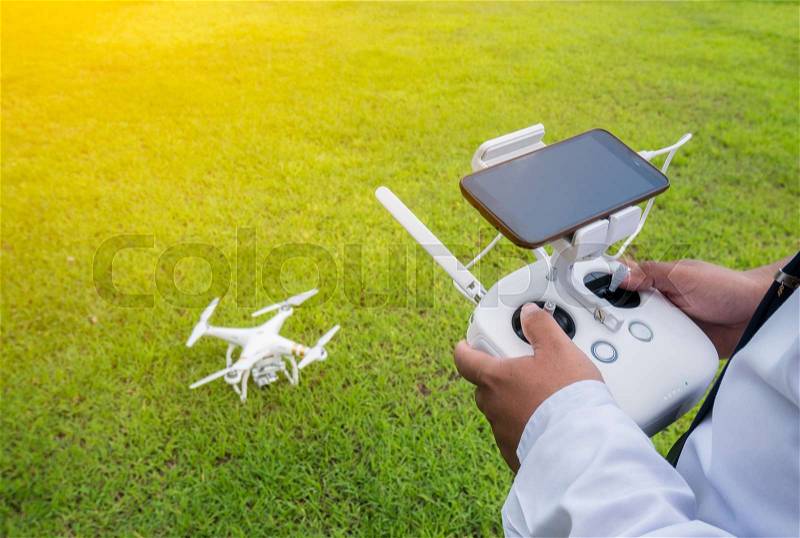 Hand holding on remote for Control drone , stock photo