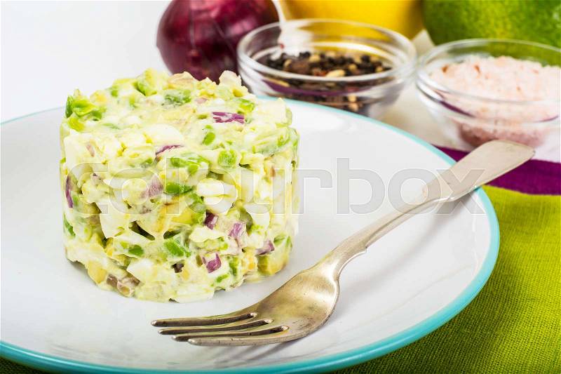 Salad with Avocado, Boiled Eggs, Red Onion and Mayonnaise. Studio Photo, stock photo