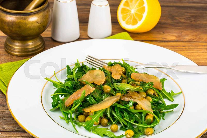 Salad with Arugula, Peas, Jerked Chicken, Mix of Peppers and Vegetable Oil Studio Photo, stock photo