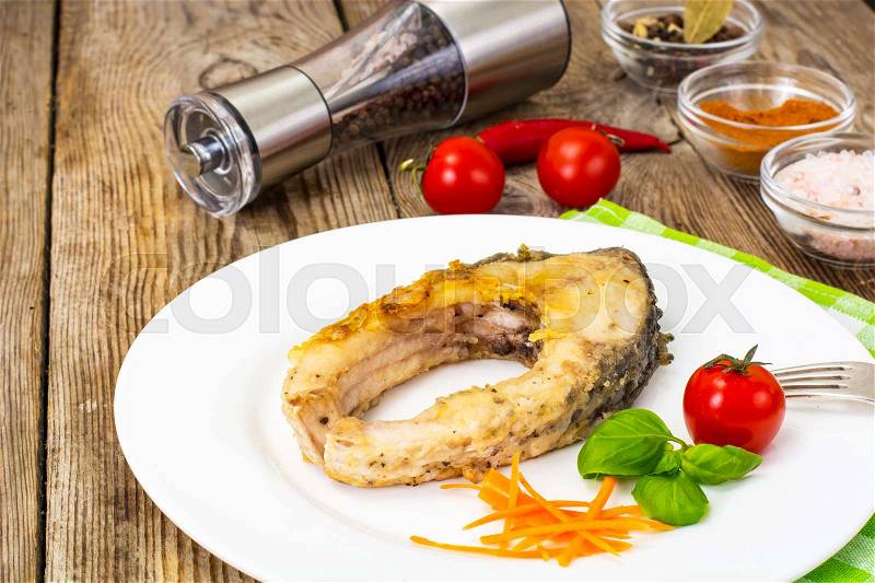 Fried white fish steaks on White Plate. Studio Photo, stock photo