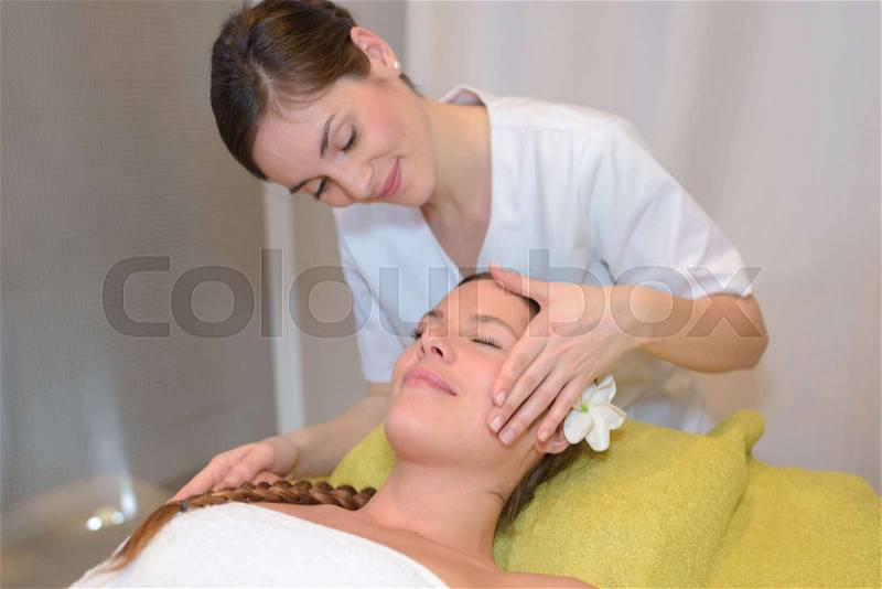 Young healthy happy woman in spa making treatments, stock photo