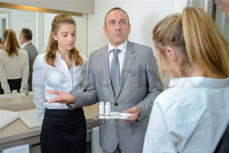 Hotel manager unhappy with the service quality, stock photo