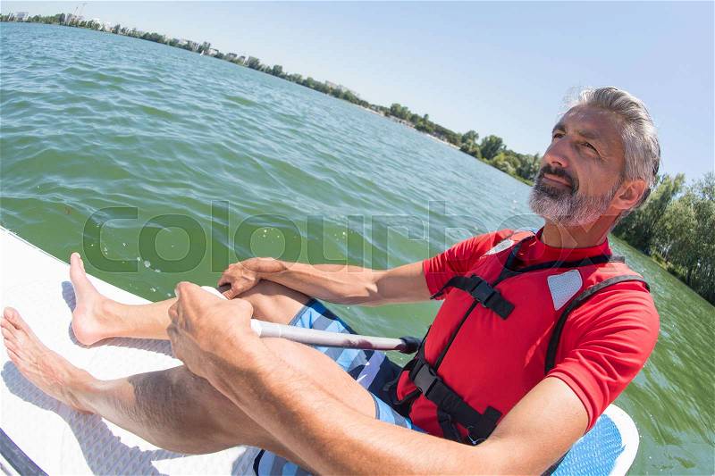 Man taking a break from stressing city life, stock photo