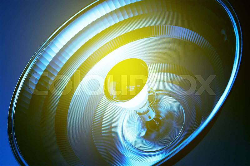 Blue light reflector in medical environment healthcare sterile room with yellow light flare\, stock photo