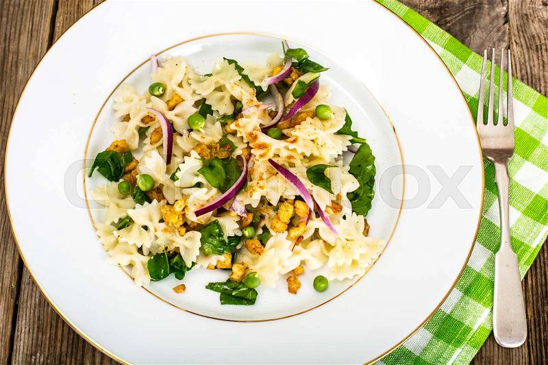 Pasta Salad with Arugula, Chicken and Red Onion Studio Photo, stock photo