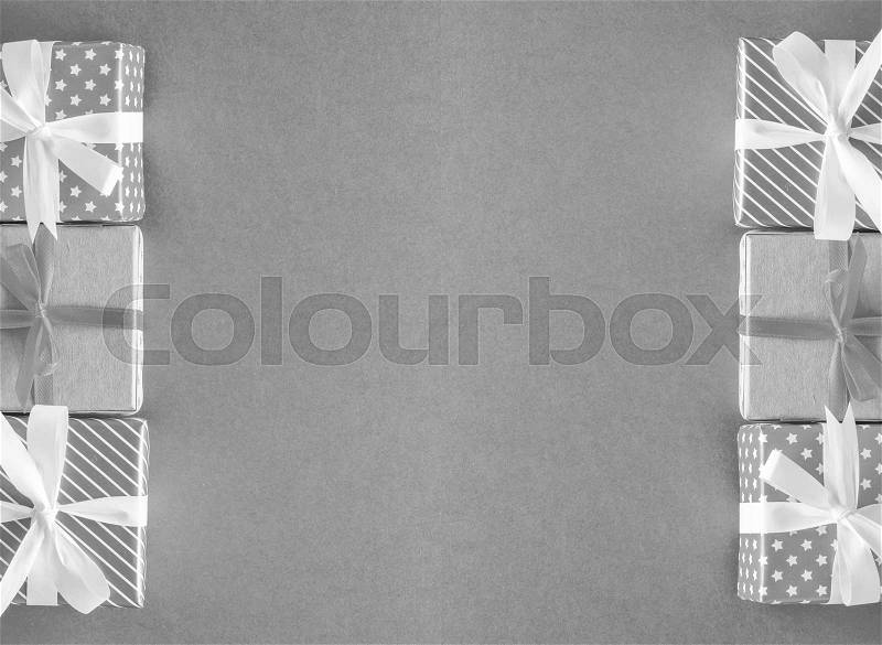Black and white different christmas presents on paper background, stock photo