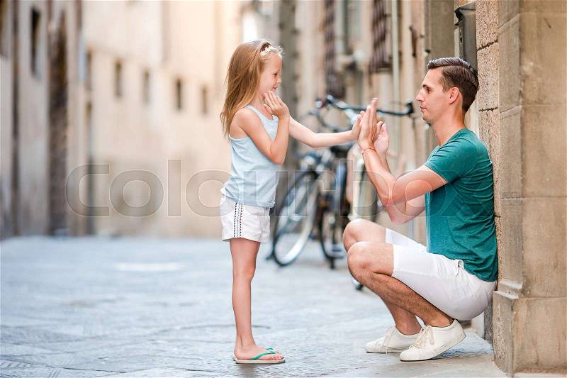 Family in Europe. Happy father and little adorable girl in Rome during summer italian vacation, stock photo